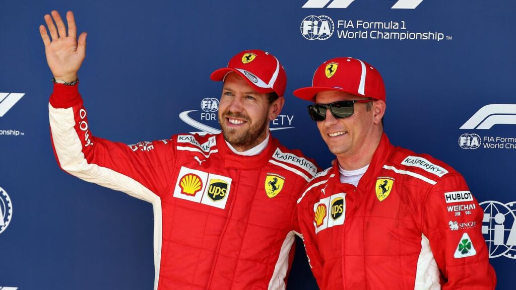 Ferrari drivers Sebastian Vettel and Kimi Raikonnen posing for a photo.