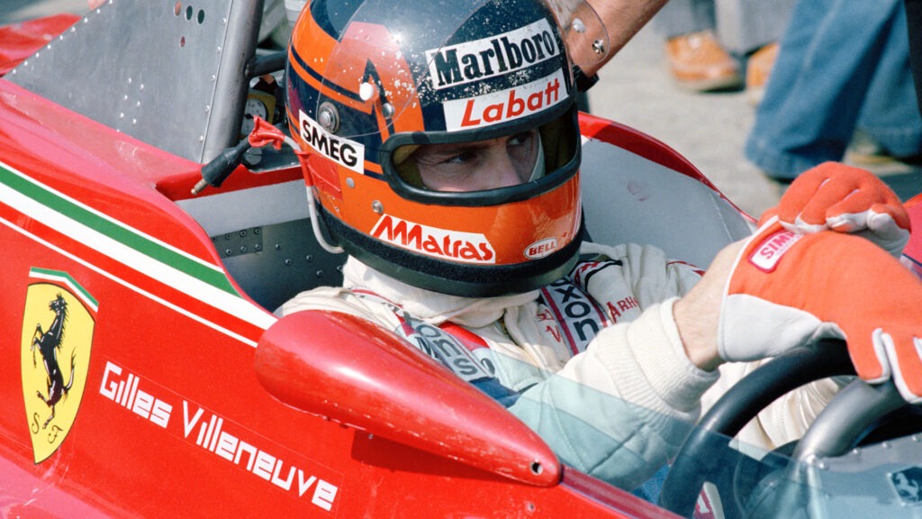 Driver Gilles Villeneuve inside his Ferrari car.