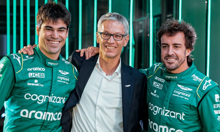 The owner of Aston Martin posing with drivers Lance Stroll and Fernando Alonso ready for the 2023 season.