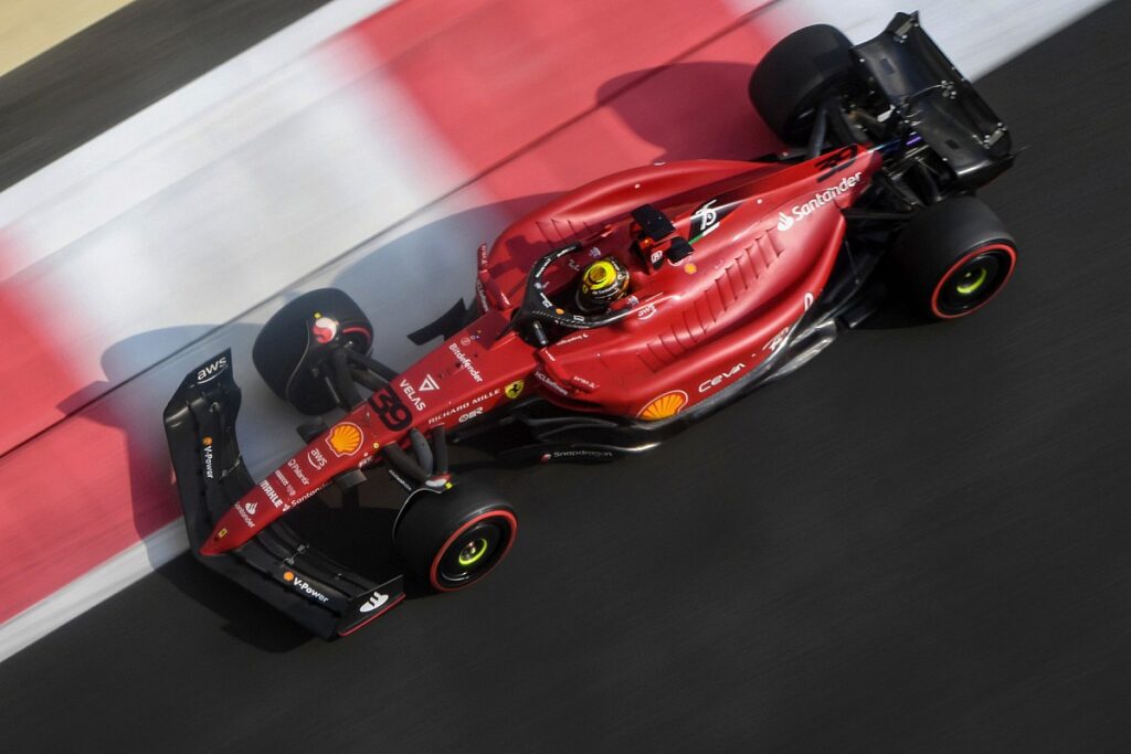 Ferrari car accelerating during a race.