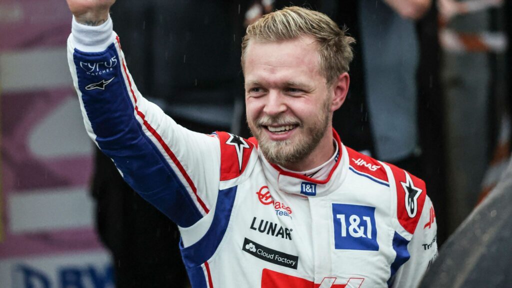Kevin Magnussen cheering the crowd in Haas colours.